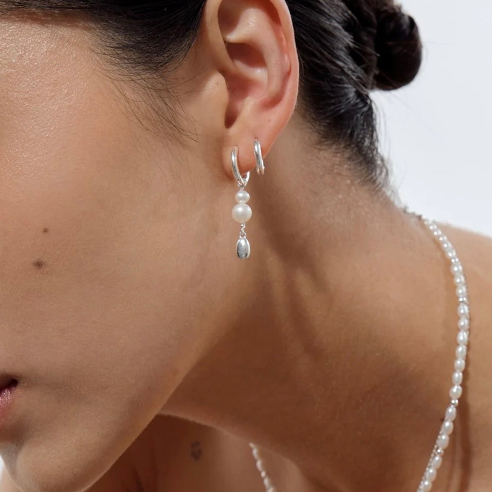 Linda Tahija - Brook Pearl Huggie Hoops - The Flower Crate